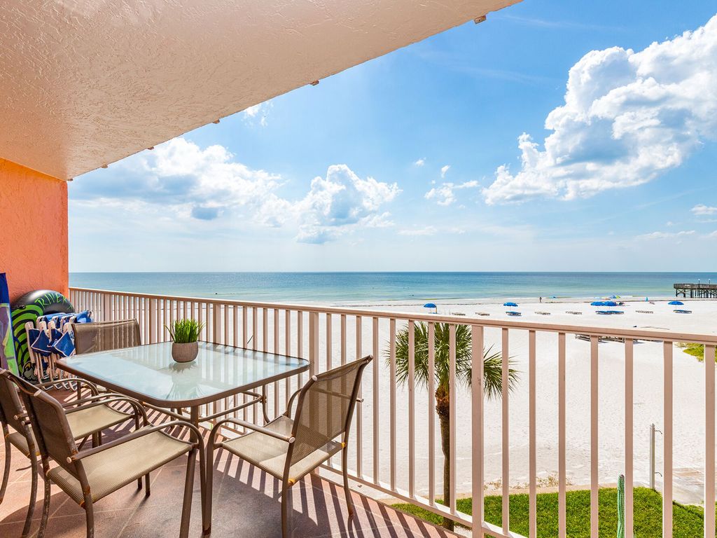 Beach view over Indian Rocks Beach sand and pier
