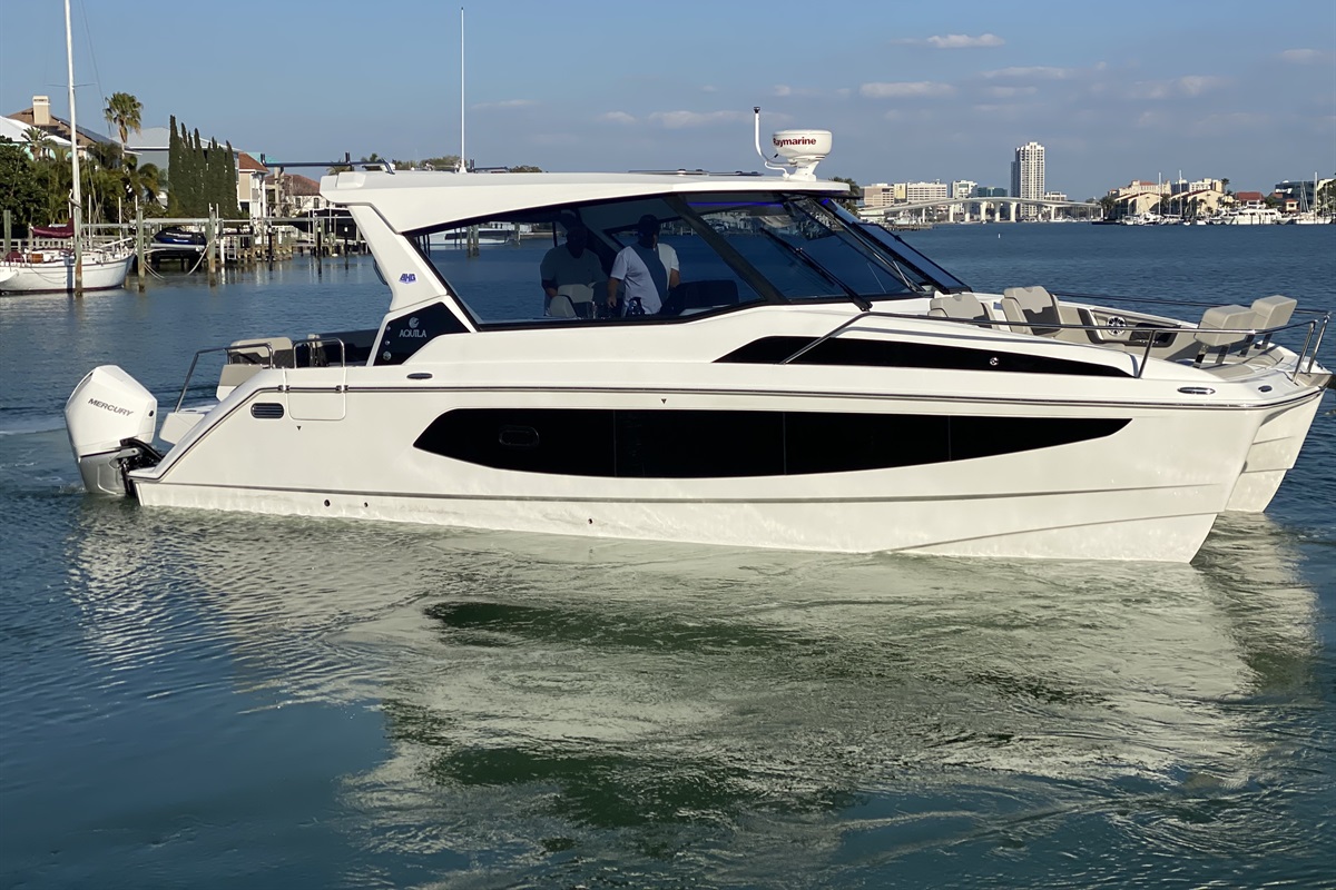 Luxury Aquila catamaran boat charter on the water