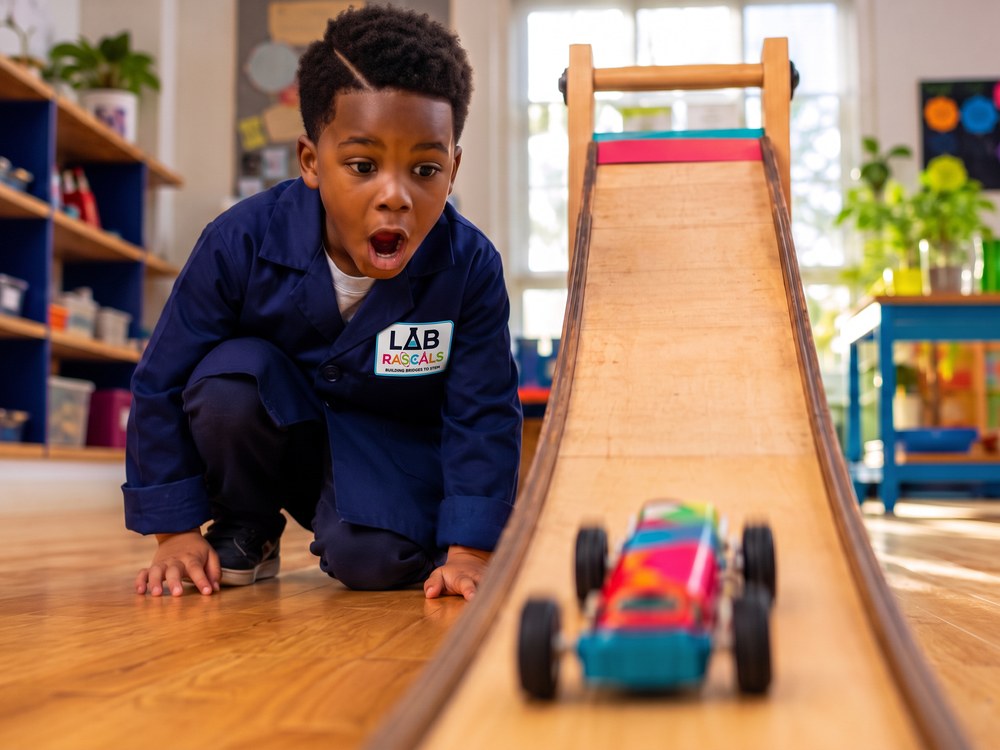 Student exploring motion with a classroom ramp