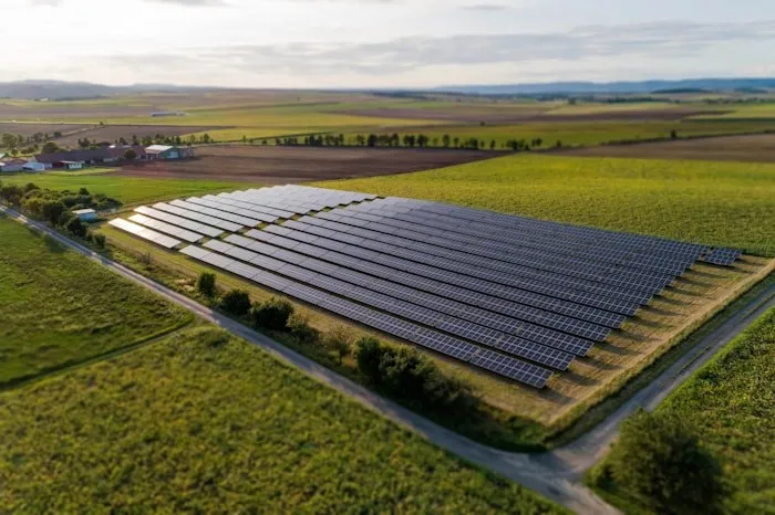 Aerial view of a solar farm in open farmland