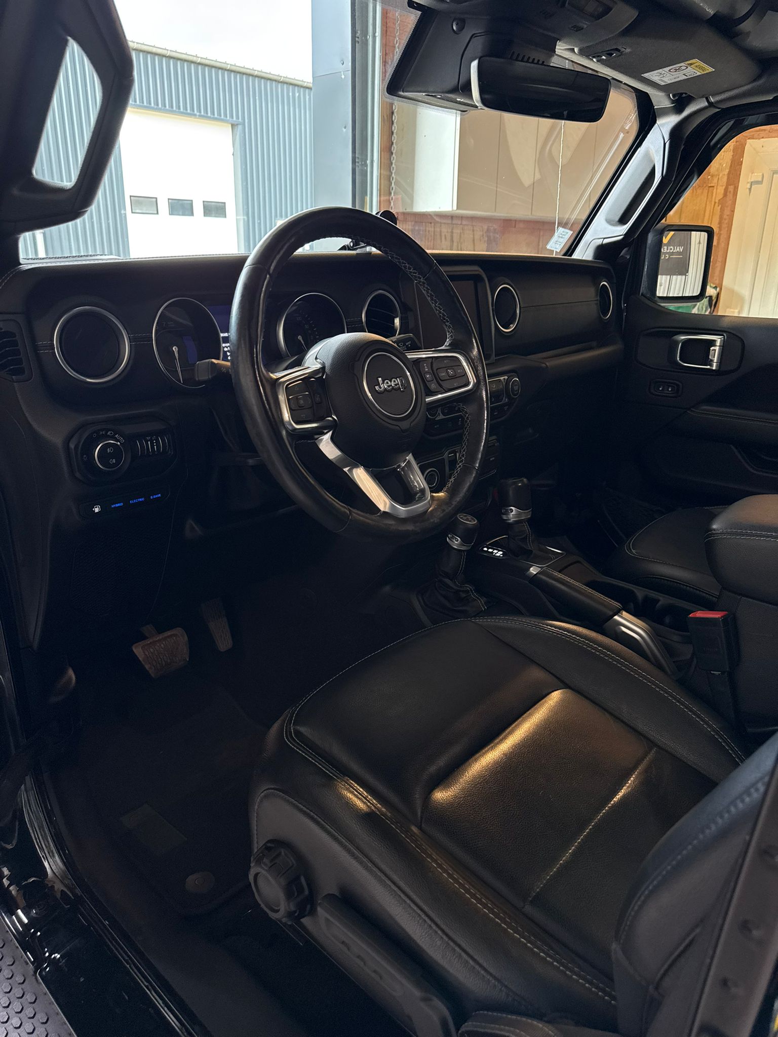 Dark car interior, left side with a focus on the gear