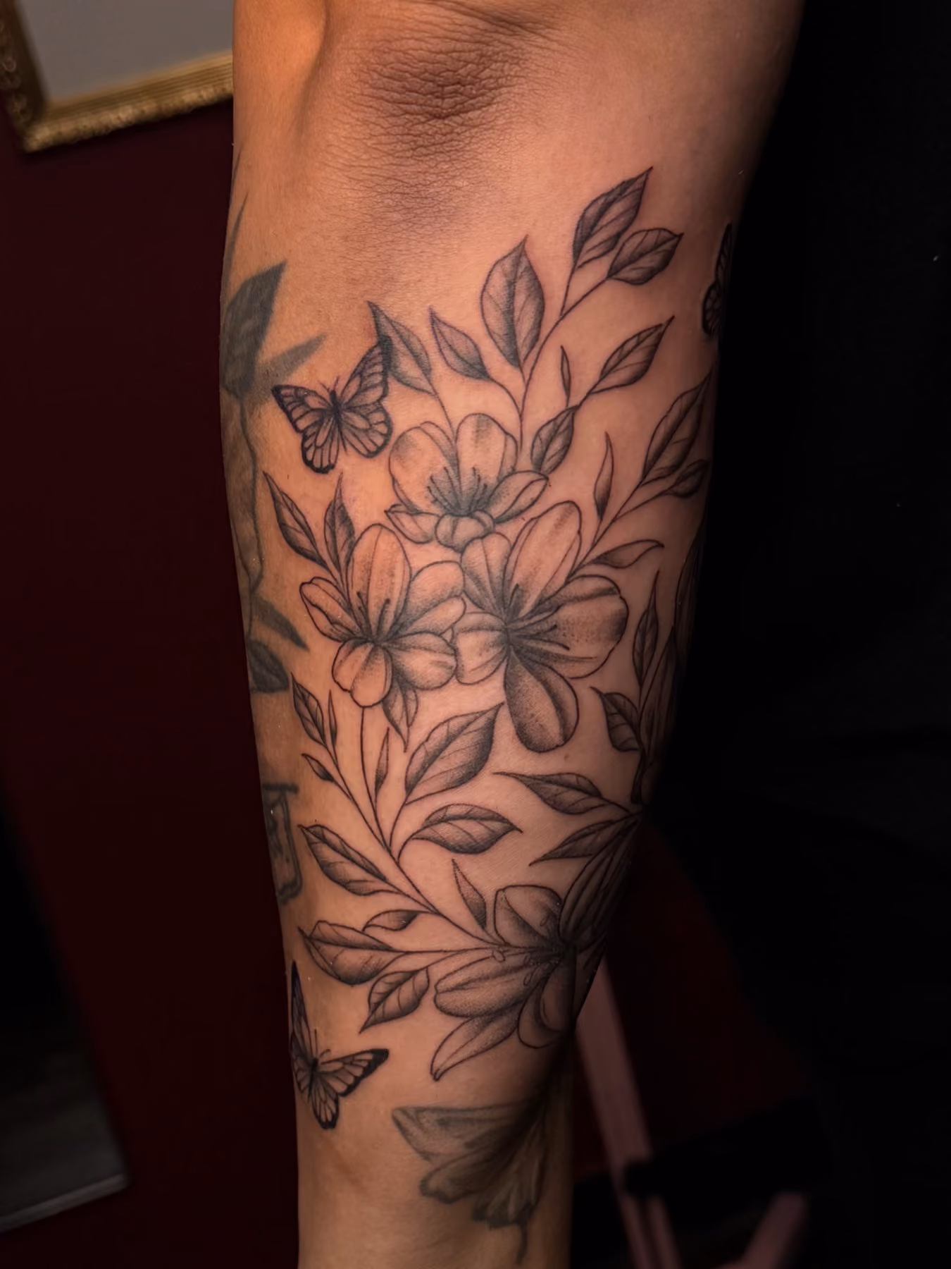 Floral and butterfly sleeve in black and grey