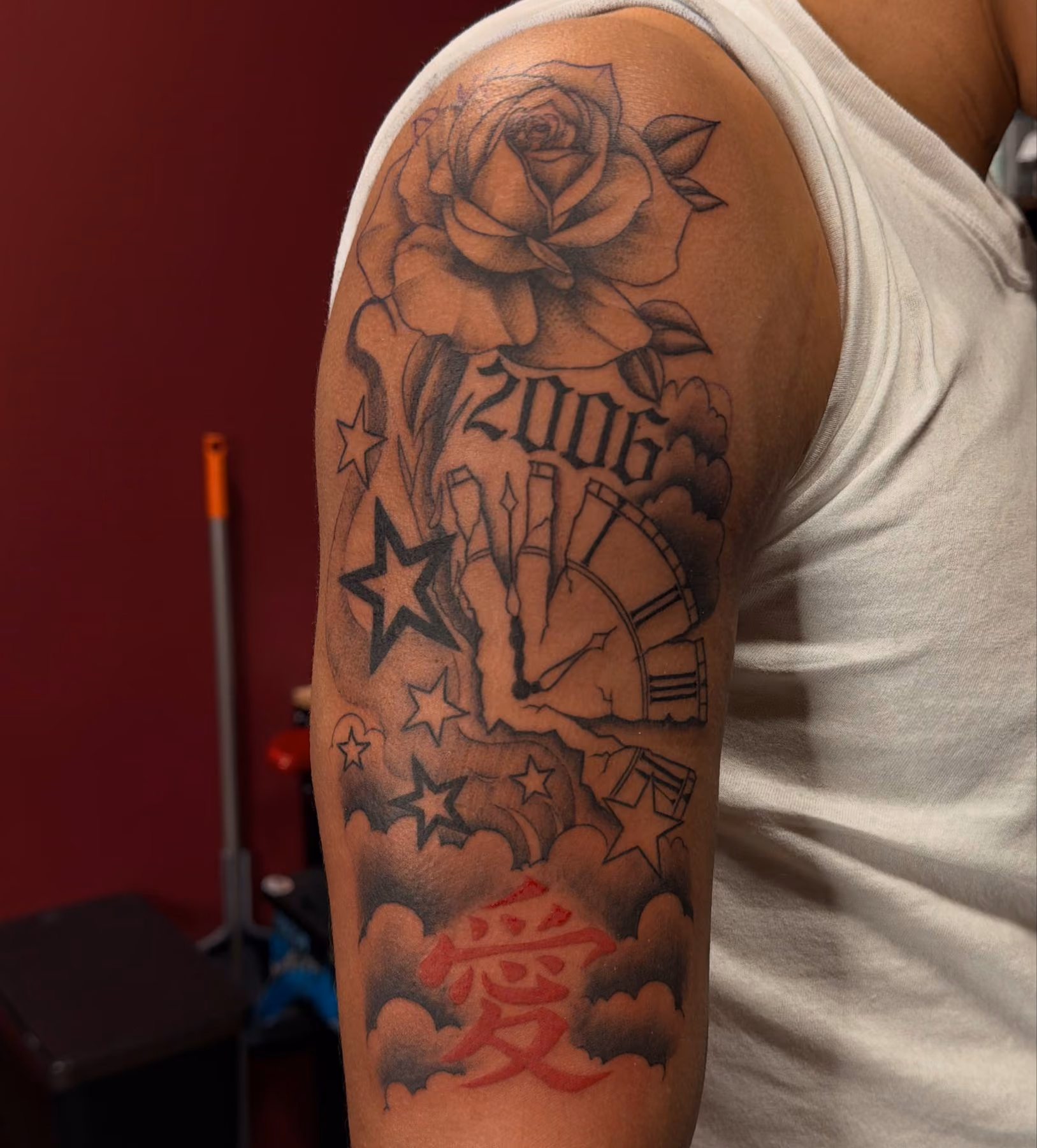Black and grey rose, clock and stars half sleeve tattoo by Thorn & Dagger Ink, Poughkeepsie NY