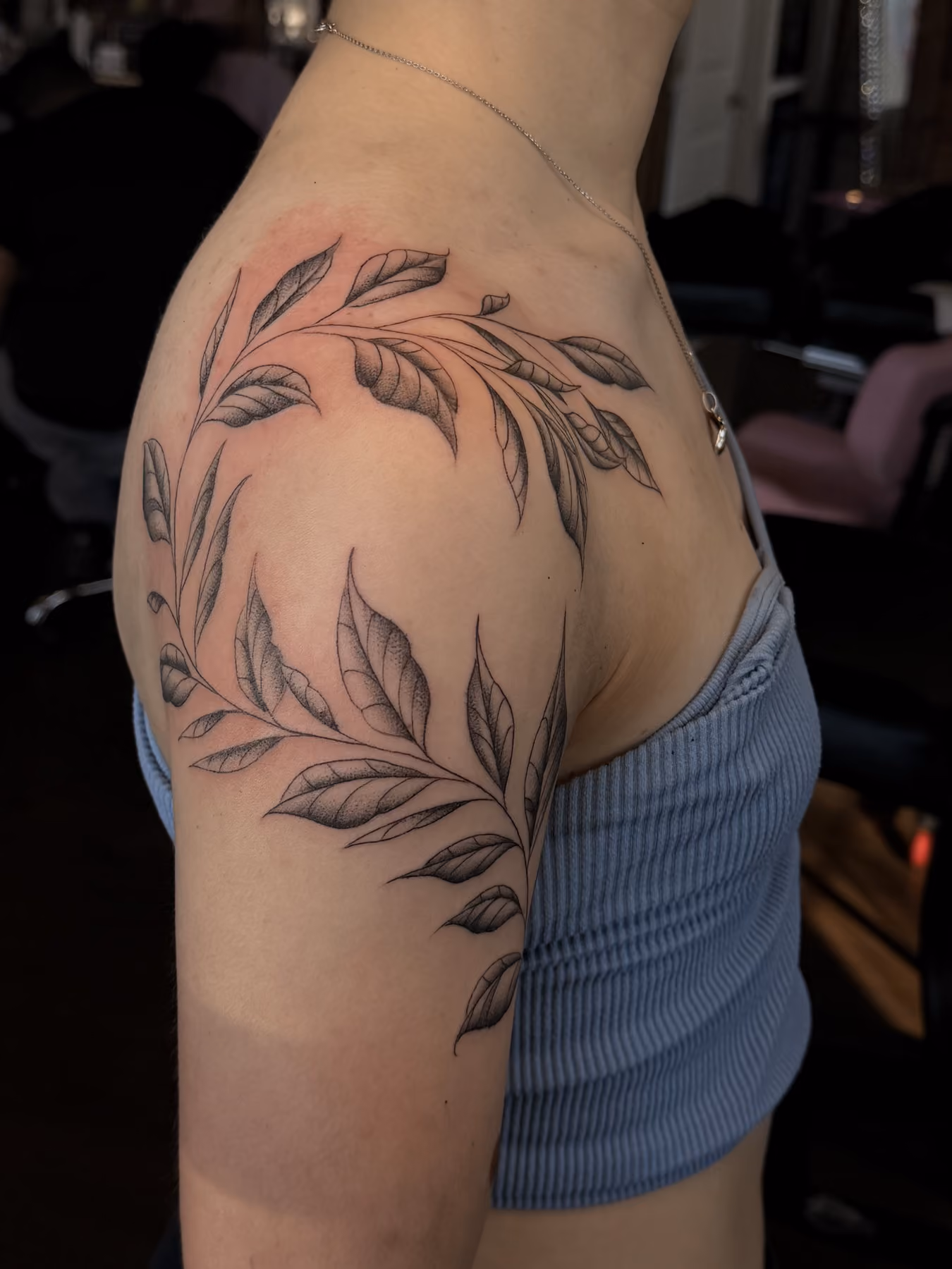 Fine line leaves arm tattoo at Thorn & Dagger Ink