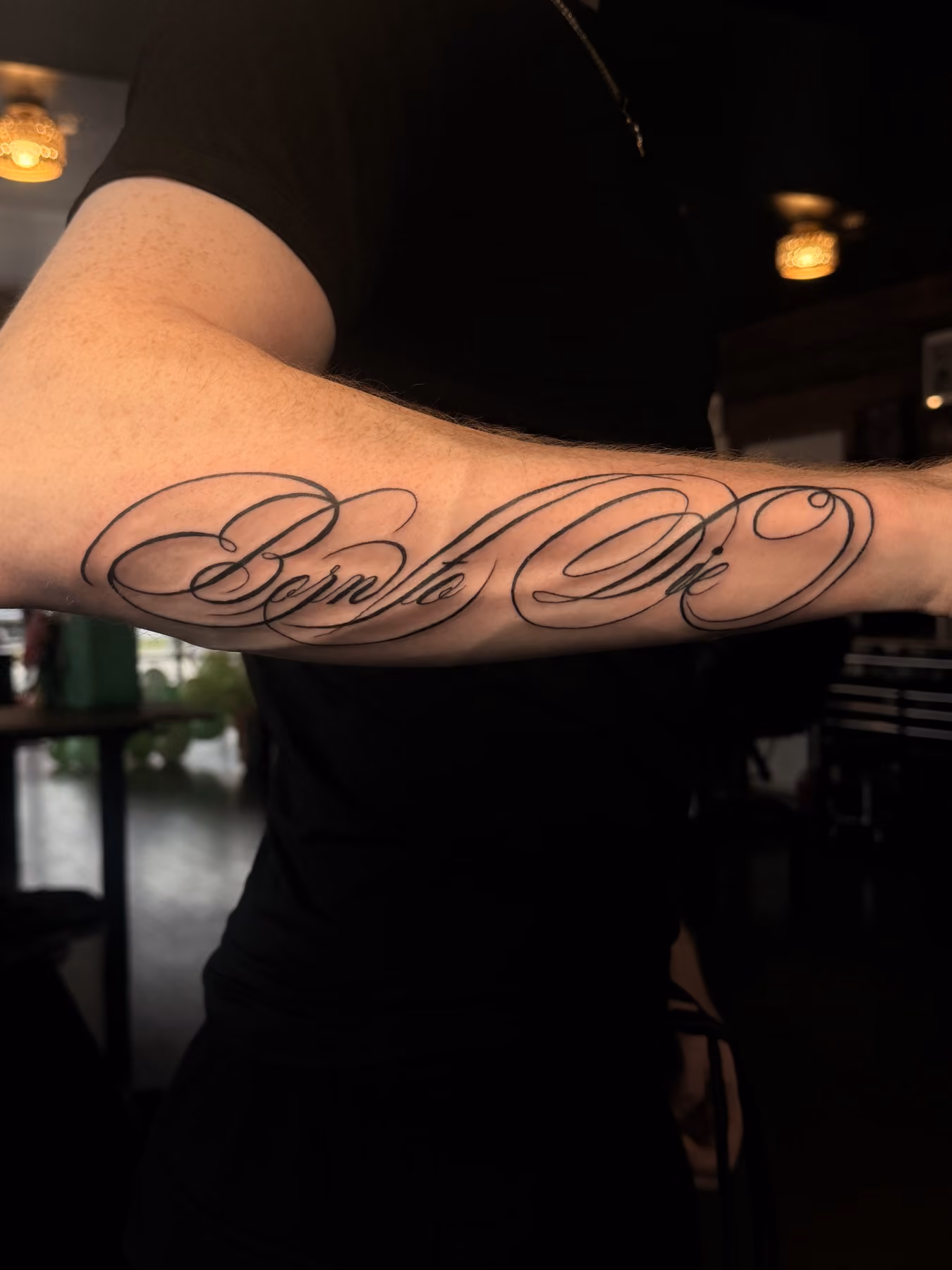 Script lettering forearm tattoo by a Poughkeepsie tattoo artist