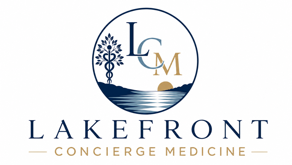 Logo featuring a circular design with the letters L, C, and M overlapping above a stylized lake at sunset with hills and a tree symbol on the left, accompanied by the text "LAKEFRONT" in large letters and "CONCIERGE MEDICINE" in smaller gold letters below.