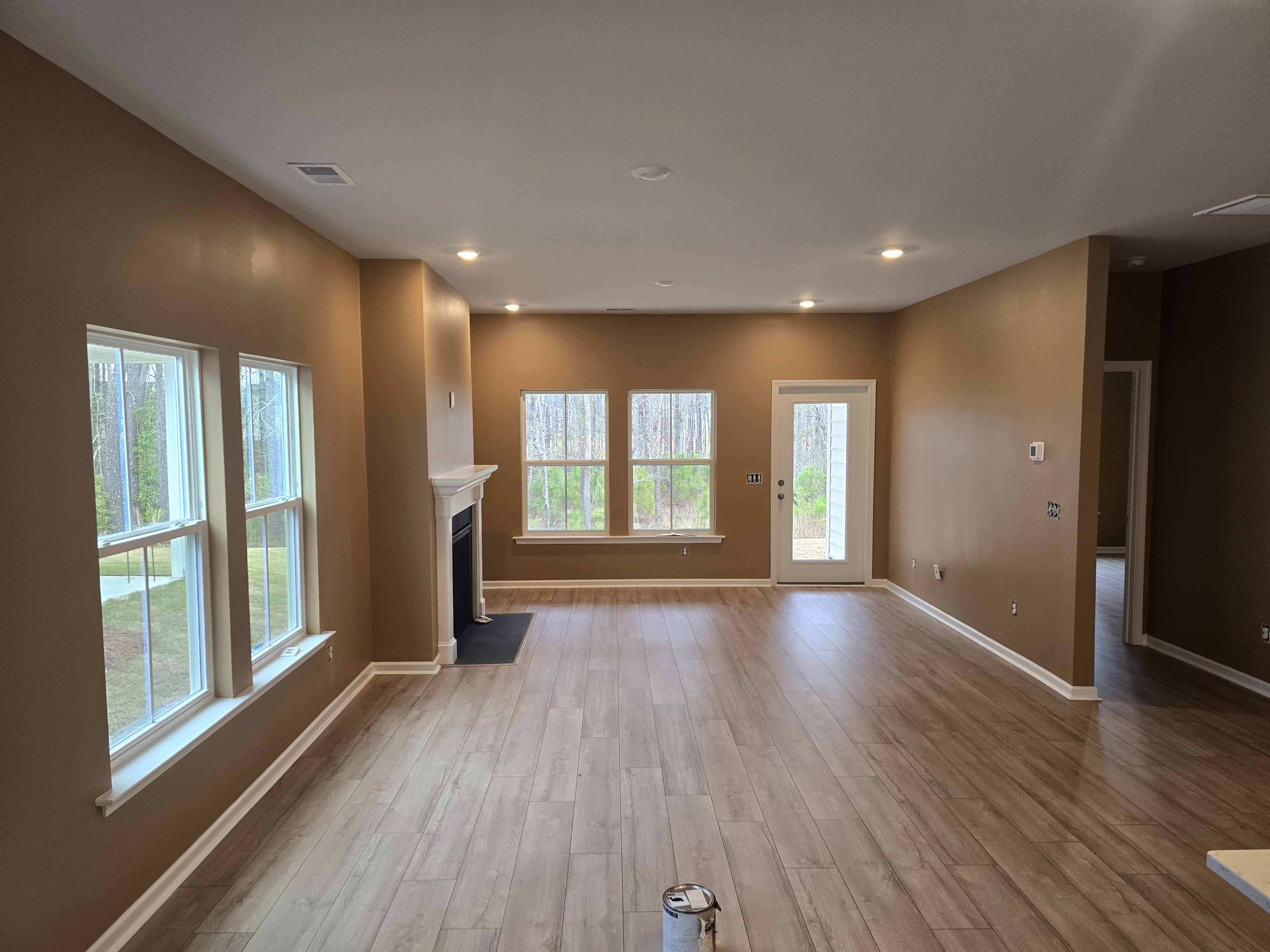 Interior painting project with smooth tan walls and crisp white trim by PaintSmart