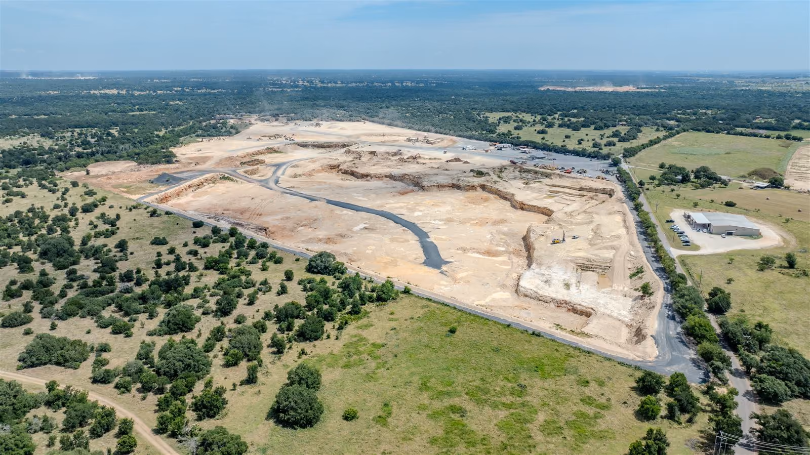 Aerial view of the quarry highwall and benches at Heartland Aggregates