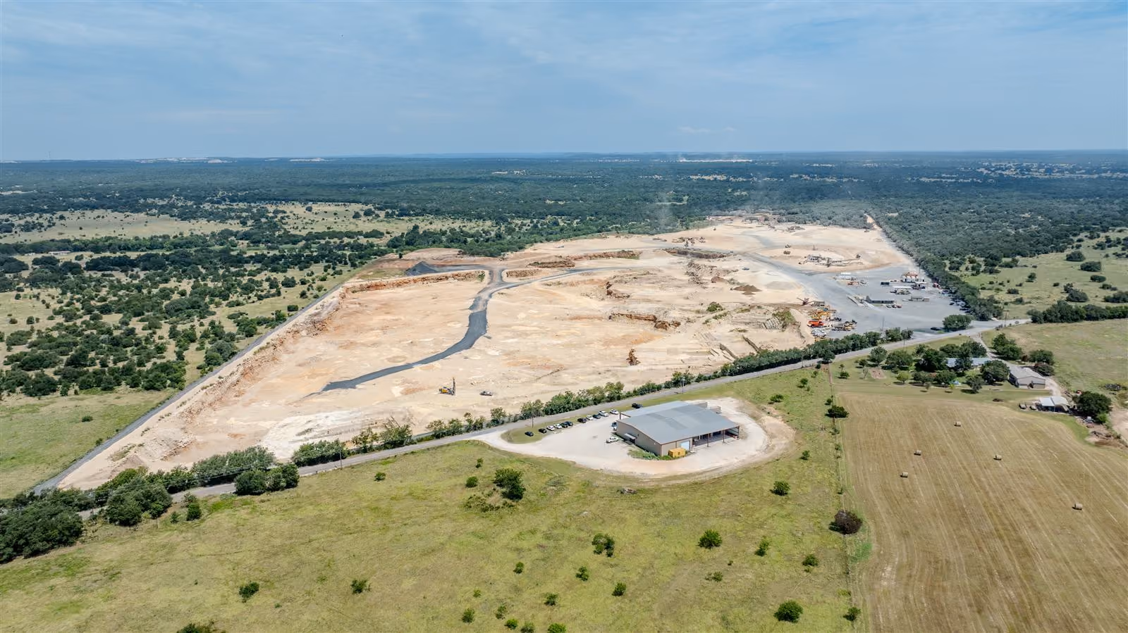 Aerial view of the Heartland Aggregates pit and office building on County Road 344