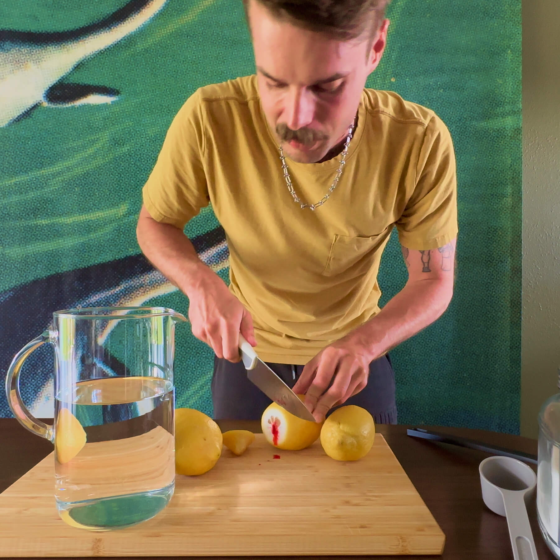 Alexander slicing lemons that are leaking red dye, an educational example of using visual hooks in ads.