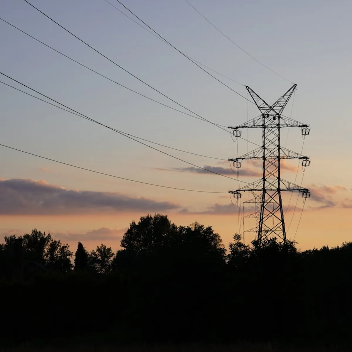 High-voltage transmission lines at dusk