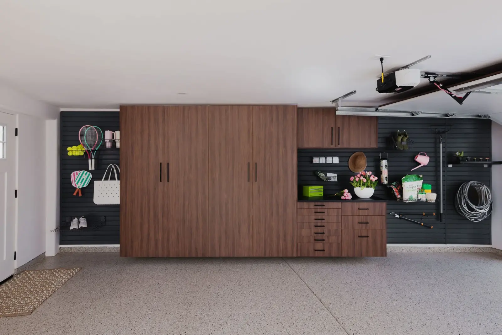 Walnut garage workbench with slatwall storage