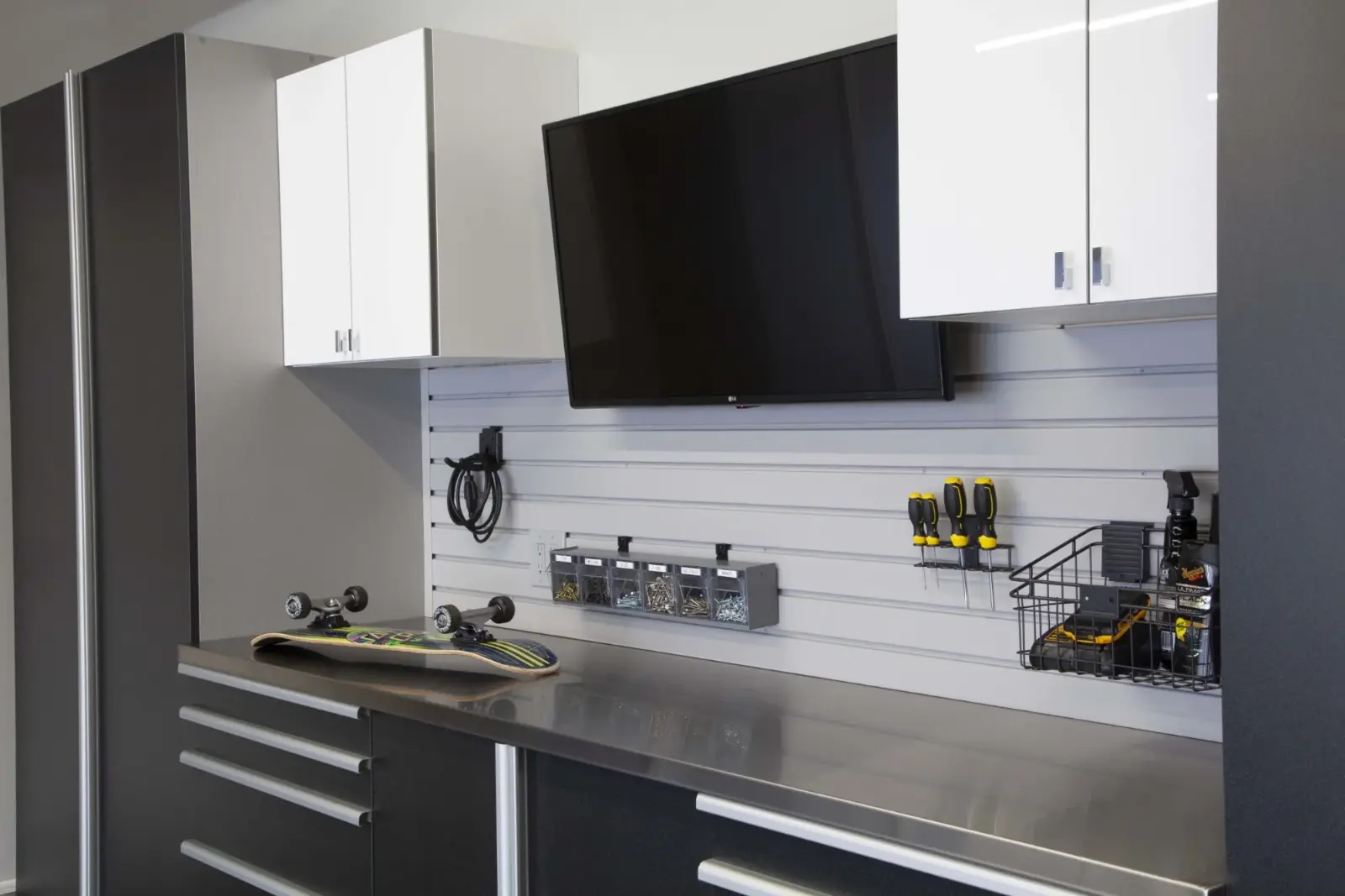 Graphite garage cabinetry with a workbench