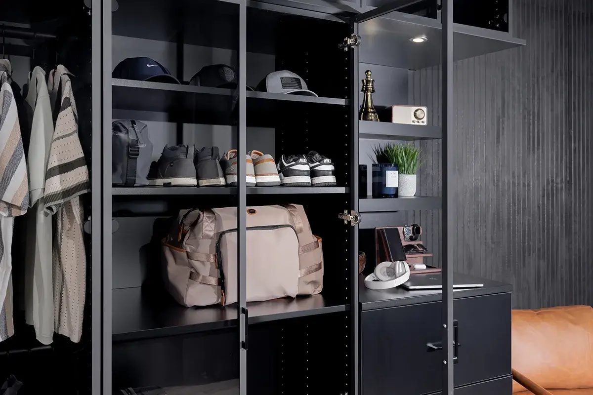 Closet with black flat-panel cabinetry and open doors