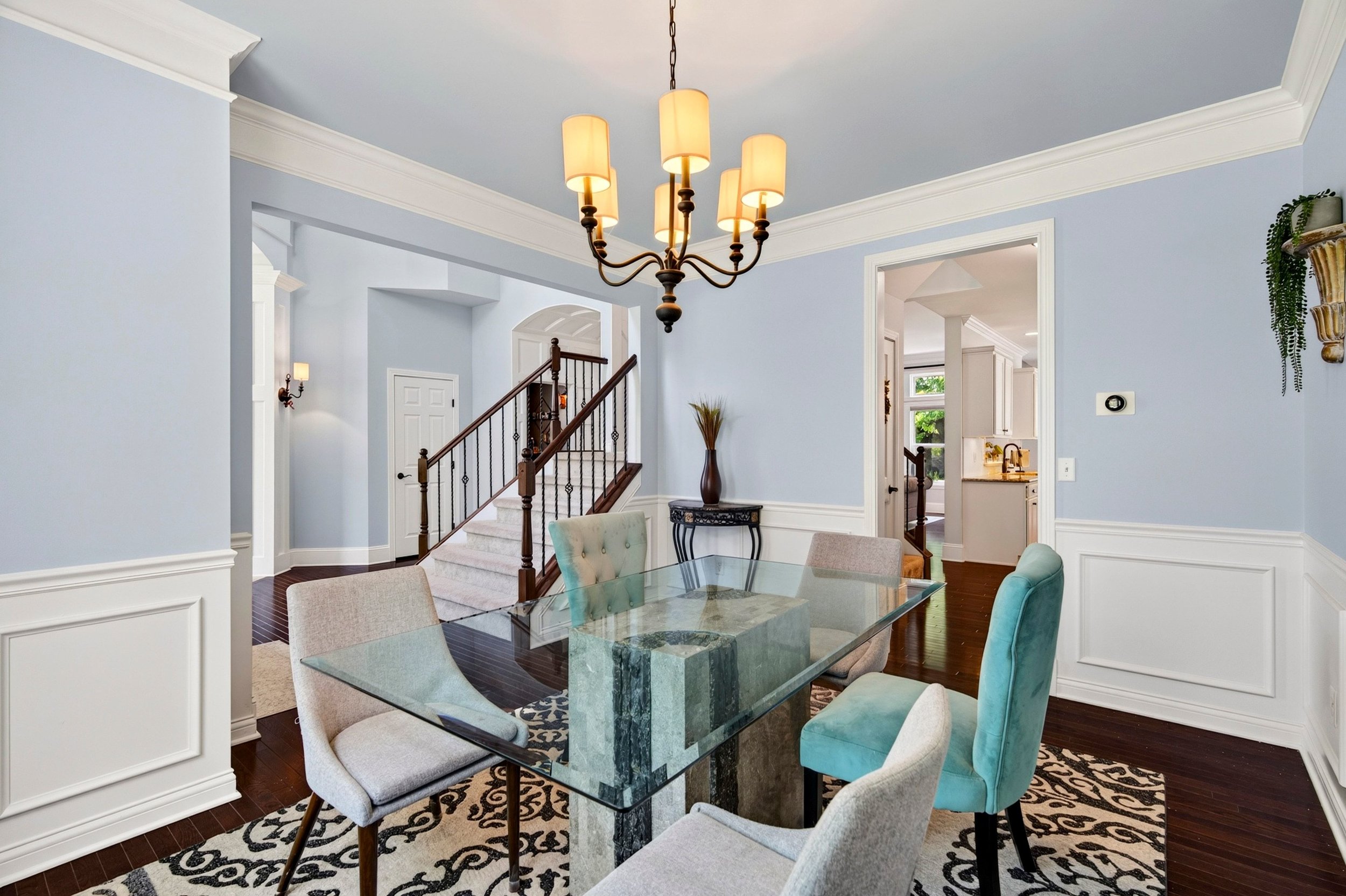 Formal dining room with chandelier and decorative trim