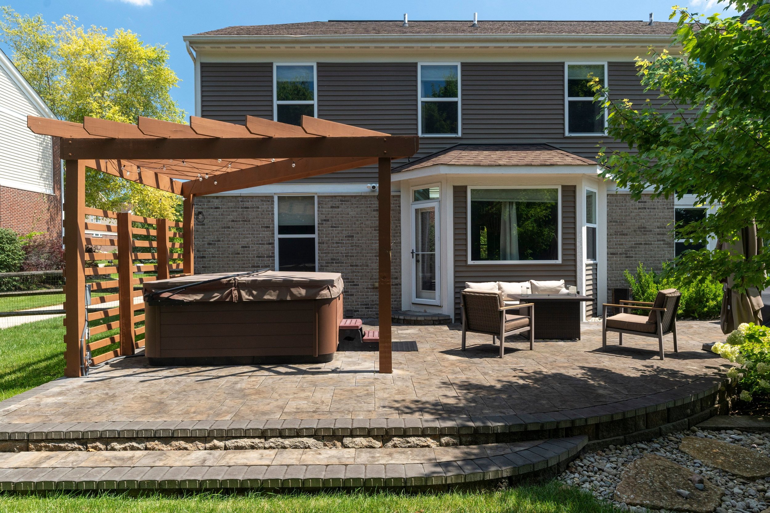 Rear paver patio and pergola at 1529 Shaker Run Boulevard