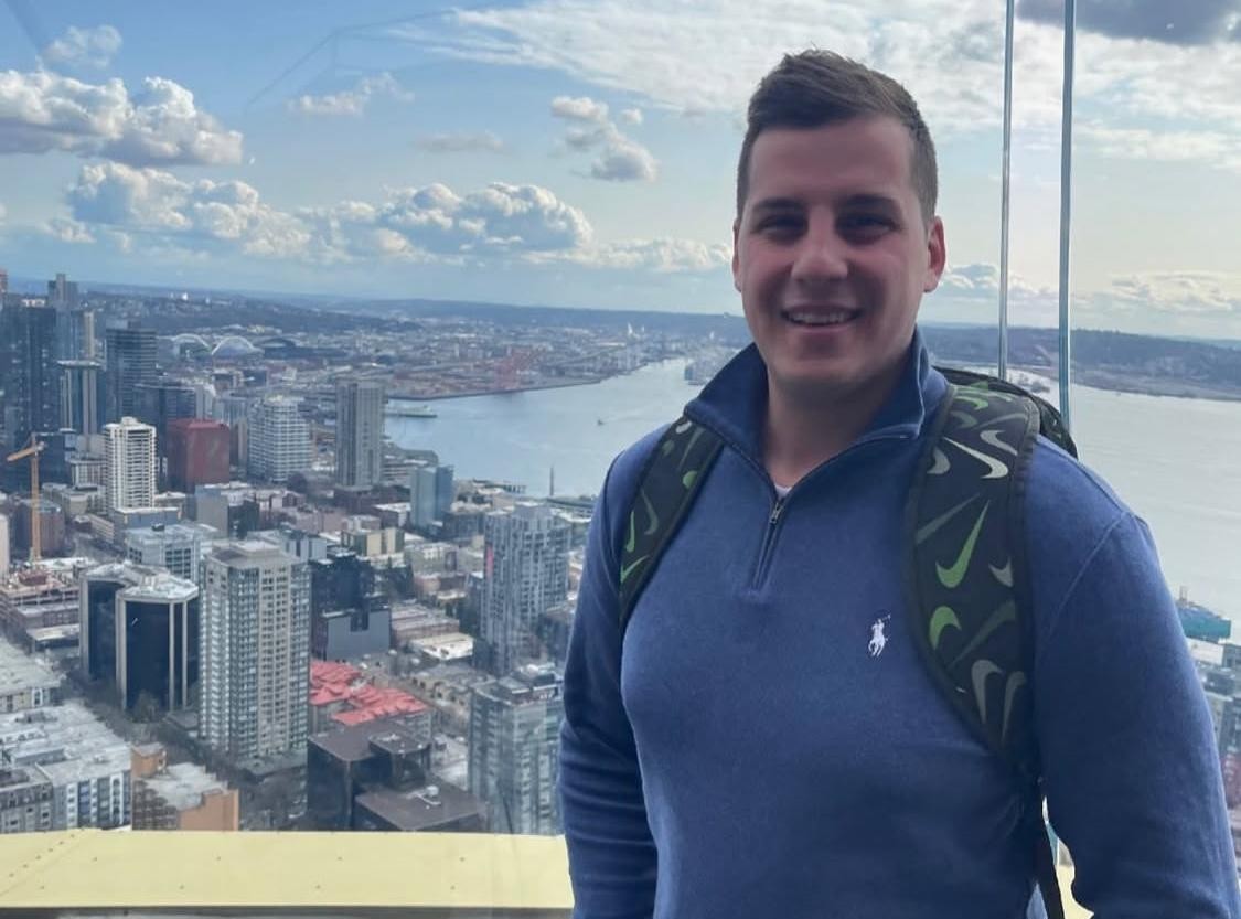 Filip visiting the U.S., overlooking the Seattle skyline