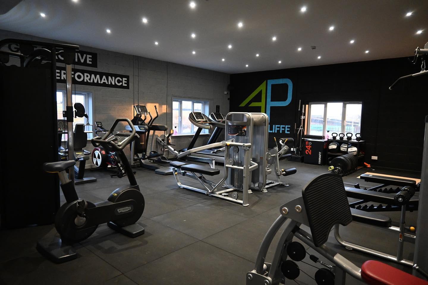 The cardio and conditioning floor at Active Performance, King’s Cliffe, under the painted Get Active Improve Performance wall