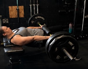Stacey six months later, doing a loaded barbell hip thrust pain-free
