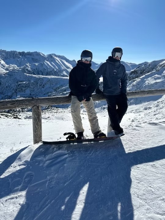 A Rudman Coaching client snowboarding