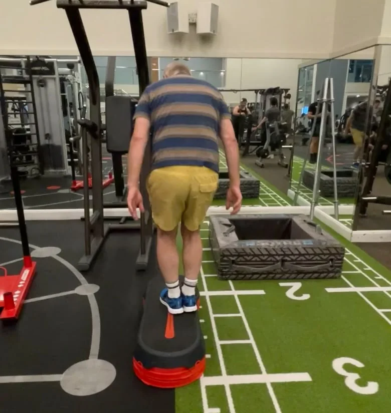 John before: stepping up onto a 10cm box in the gym, aged 60