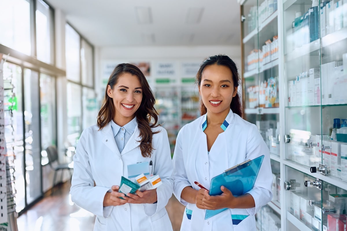 Two pharmacy technicians at work