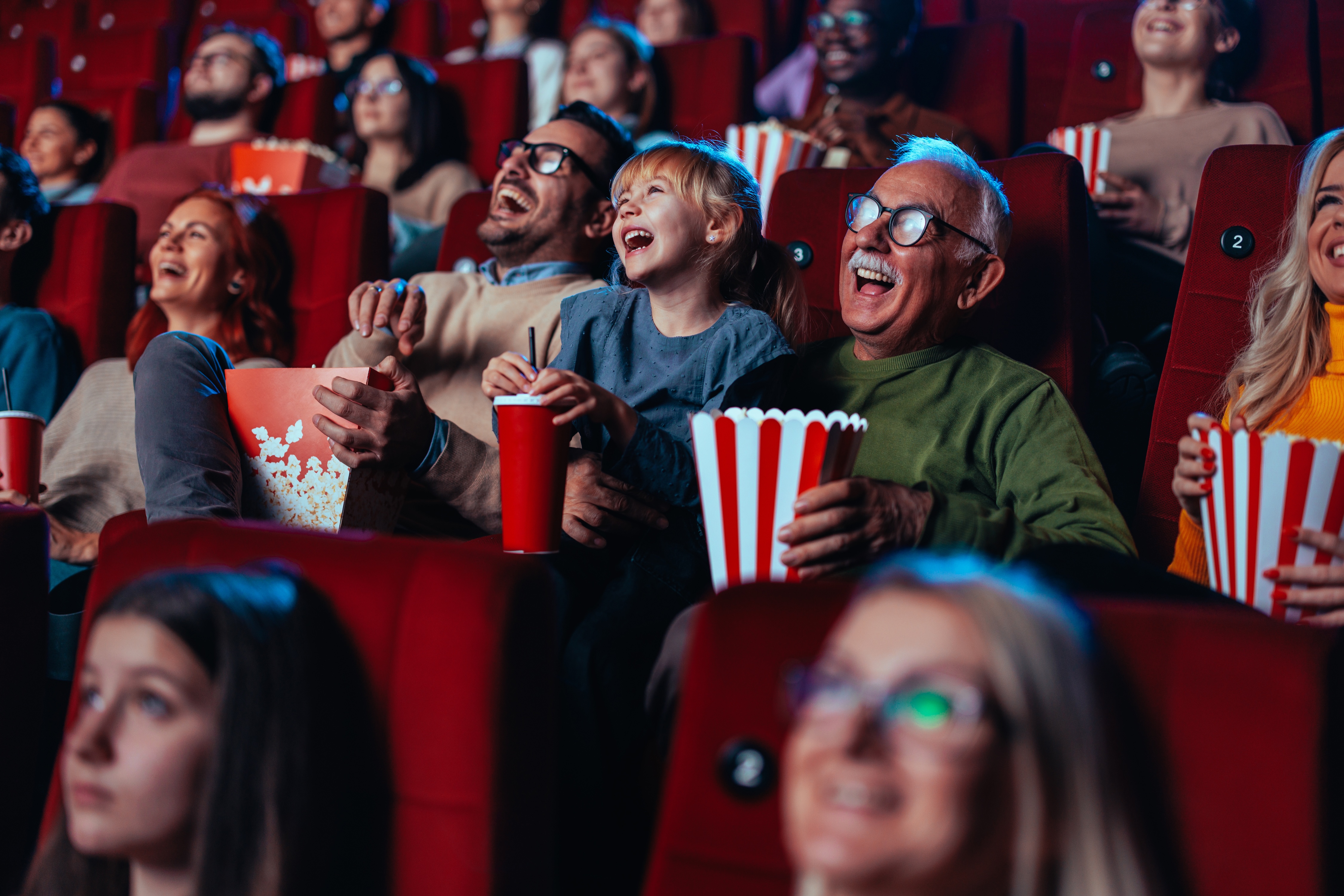 People at a movie theatre stock image