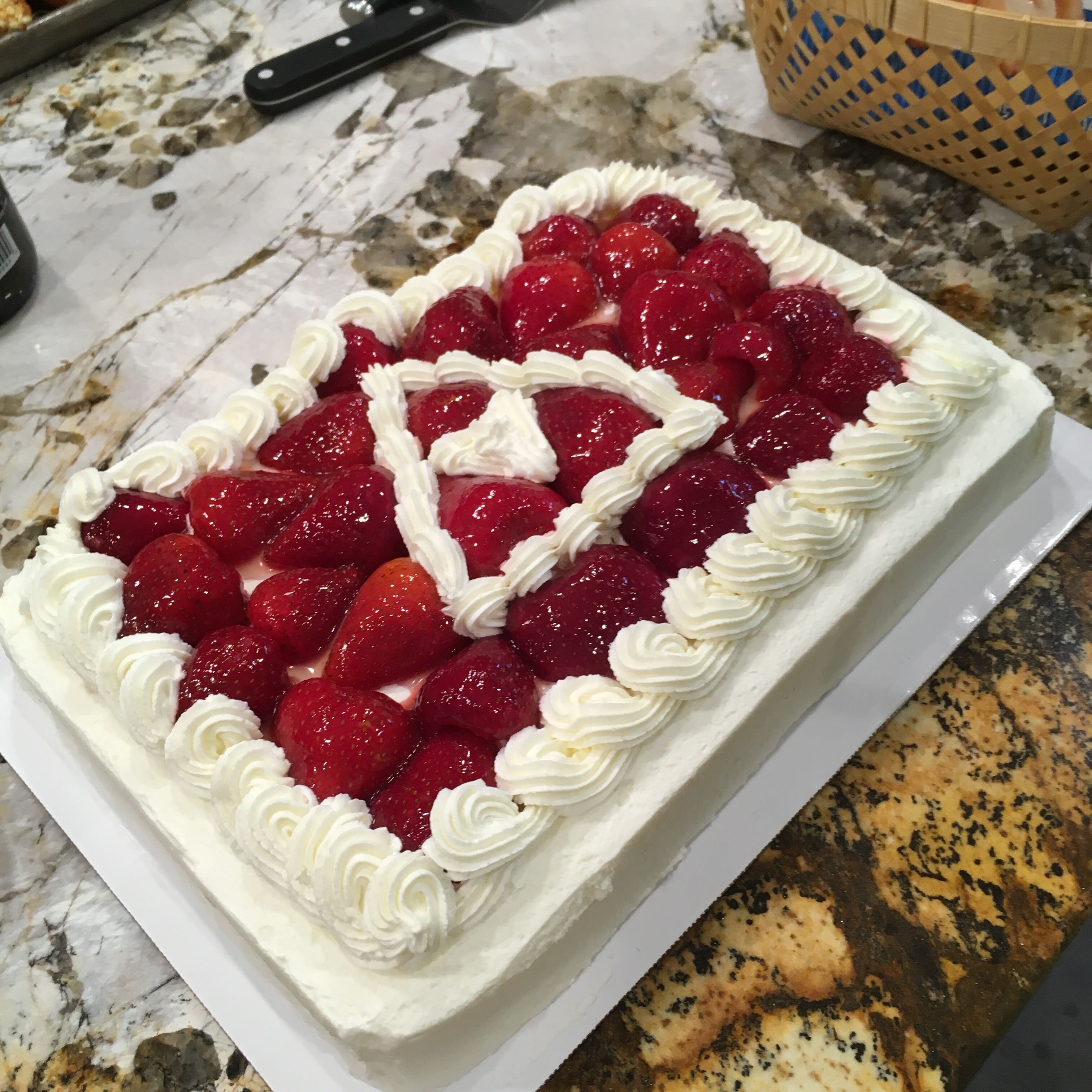 A potluck table covered in shared dishes