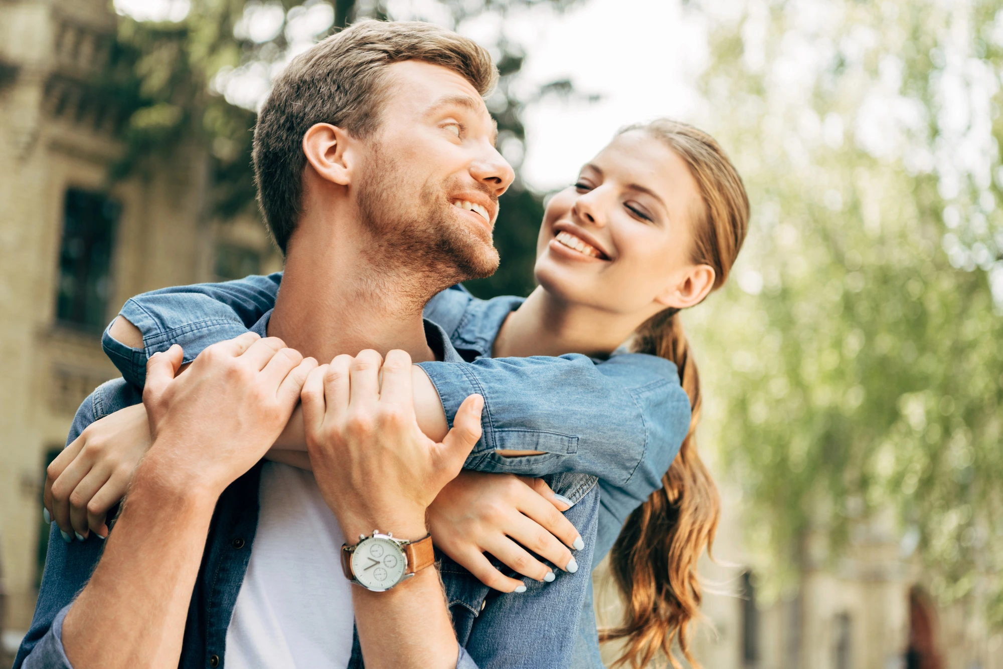 happy couple after getting dental implants in Lenoir, NC