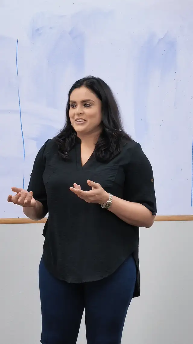 Course participant speaking to the room during presentation skills training in Singapore
