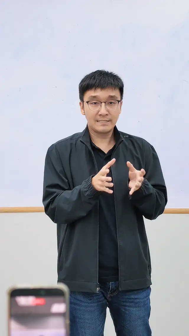 Participant filmed while practising a speech at a public speaking course in Singapore