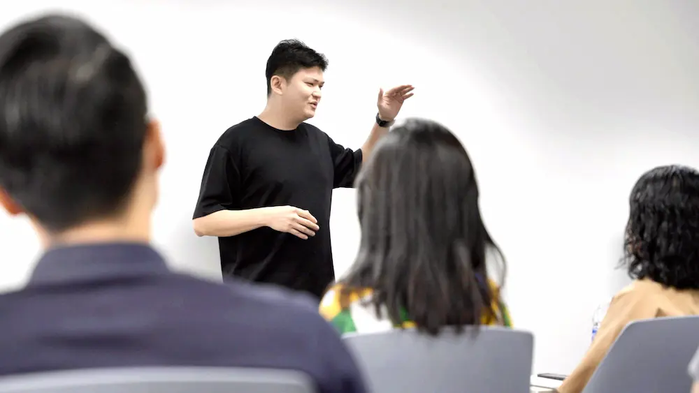 Iwan Yang teaching a small class at Speak Sell Succeed in Singapore