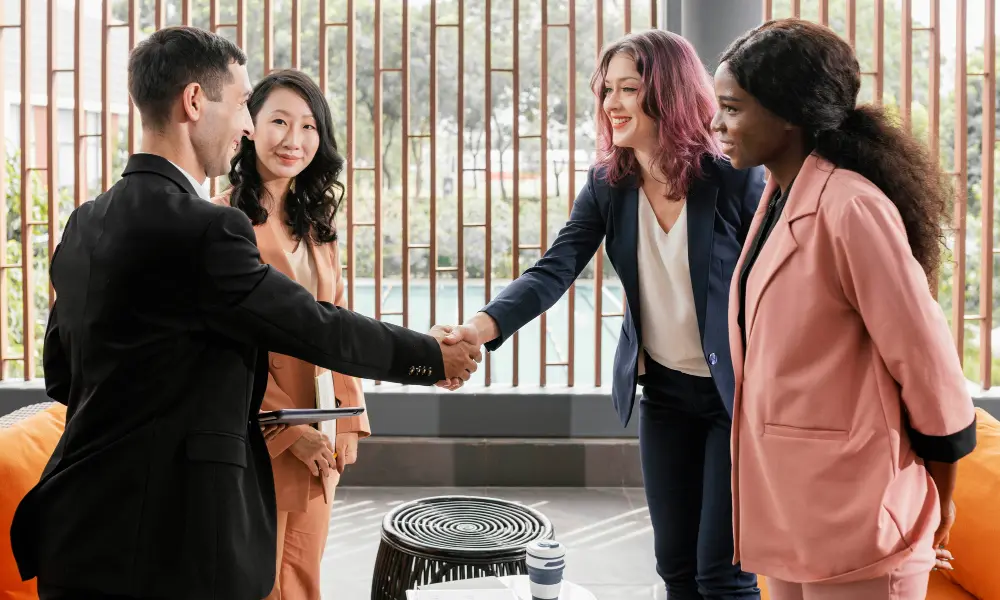 Woman showing a bar chart on a tablet as she walks a client through a proposal
