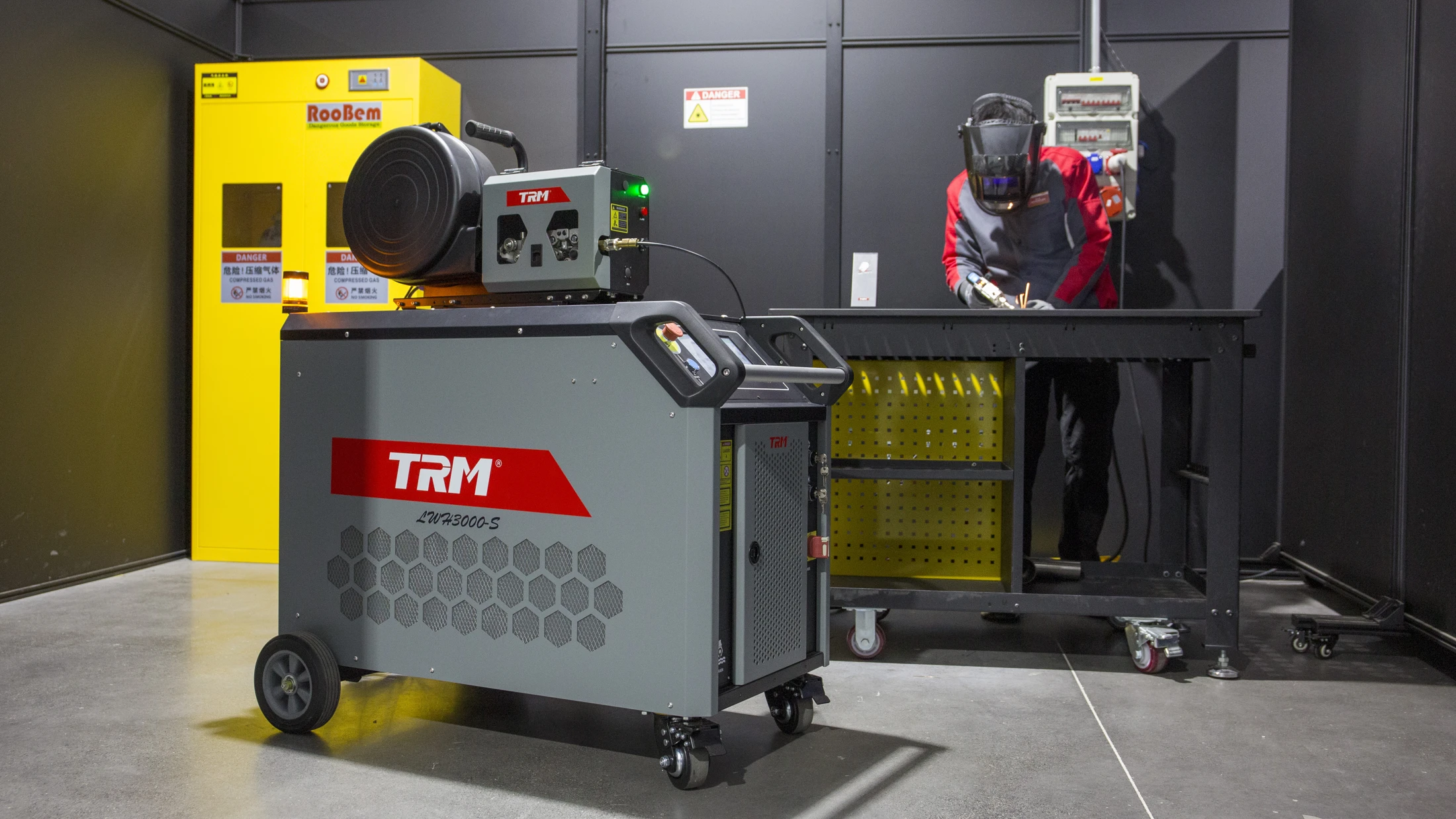 Complete TRM LWH3000-S laser welding machine and wire feeder in a fabrication workshop