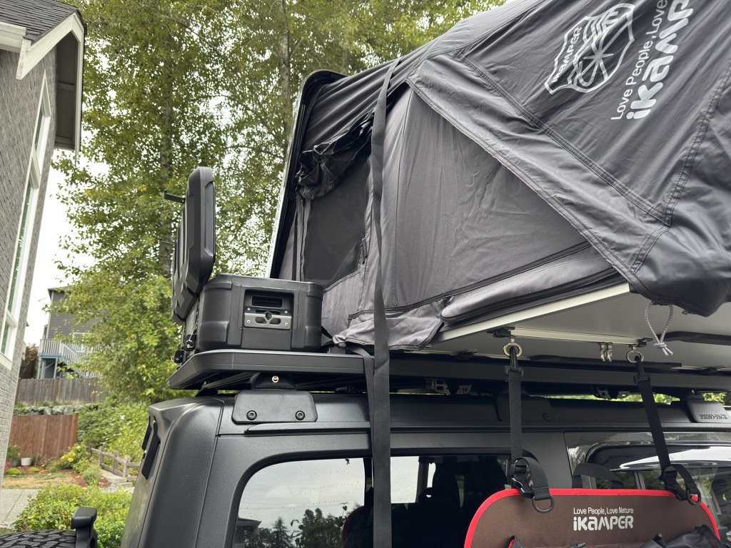 Close-up of iKamper rooftop tent mounted on Rhino-Rack crossbars
