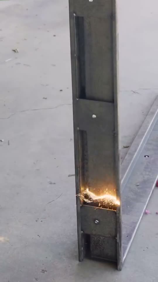 Laser cleaner removing rust from a steel door window frame