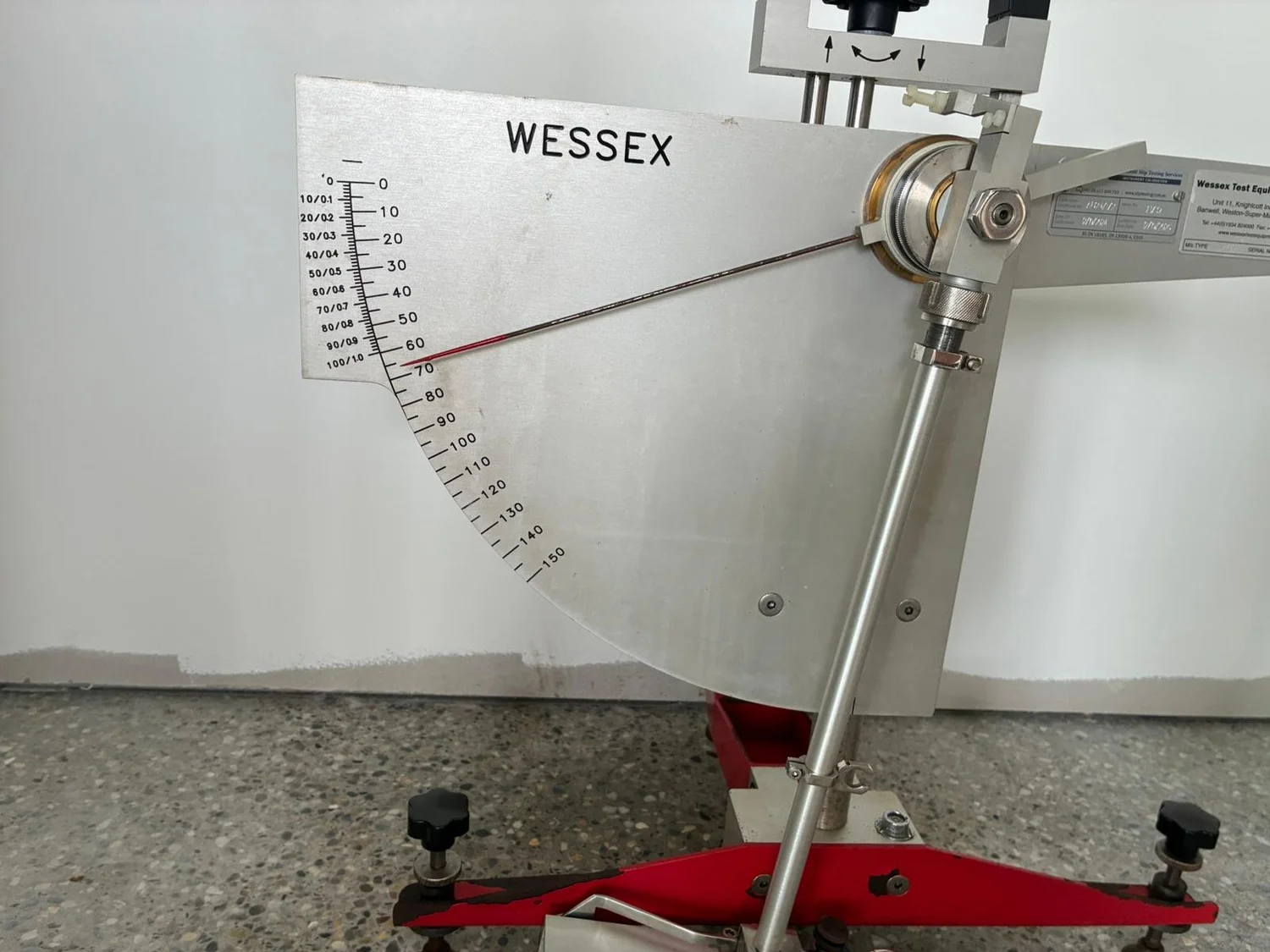 Pendulum test machine set up on a floor for slip testing