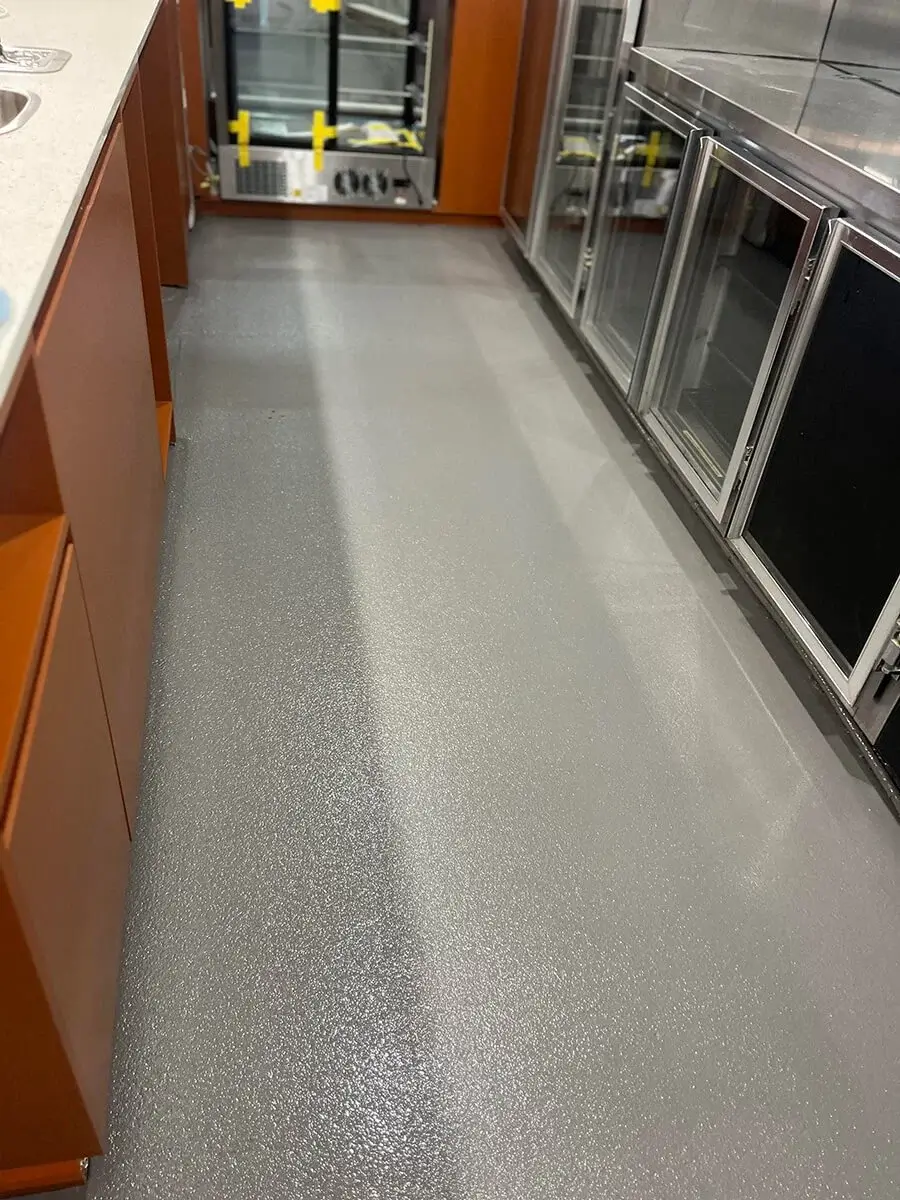 Seamless resin floor in a commercial kitchen