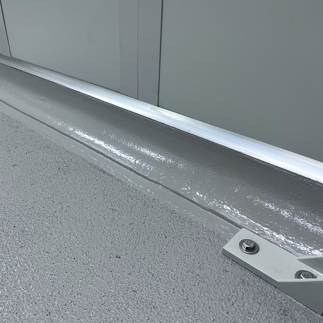Coved resin skirting where a food grade floor meets the wall