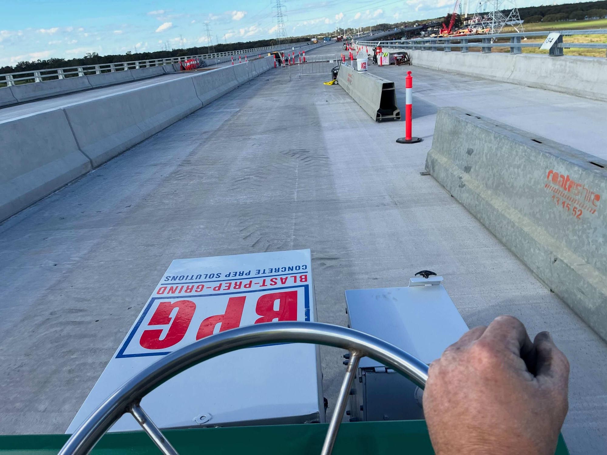 Shot blasting a bridge deck to profile the concrete