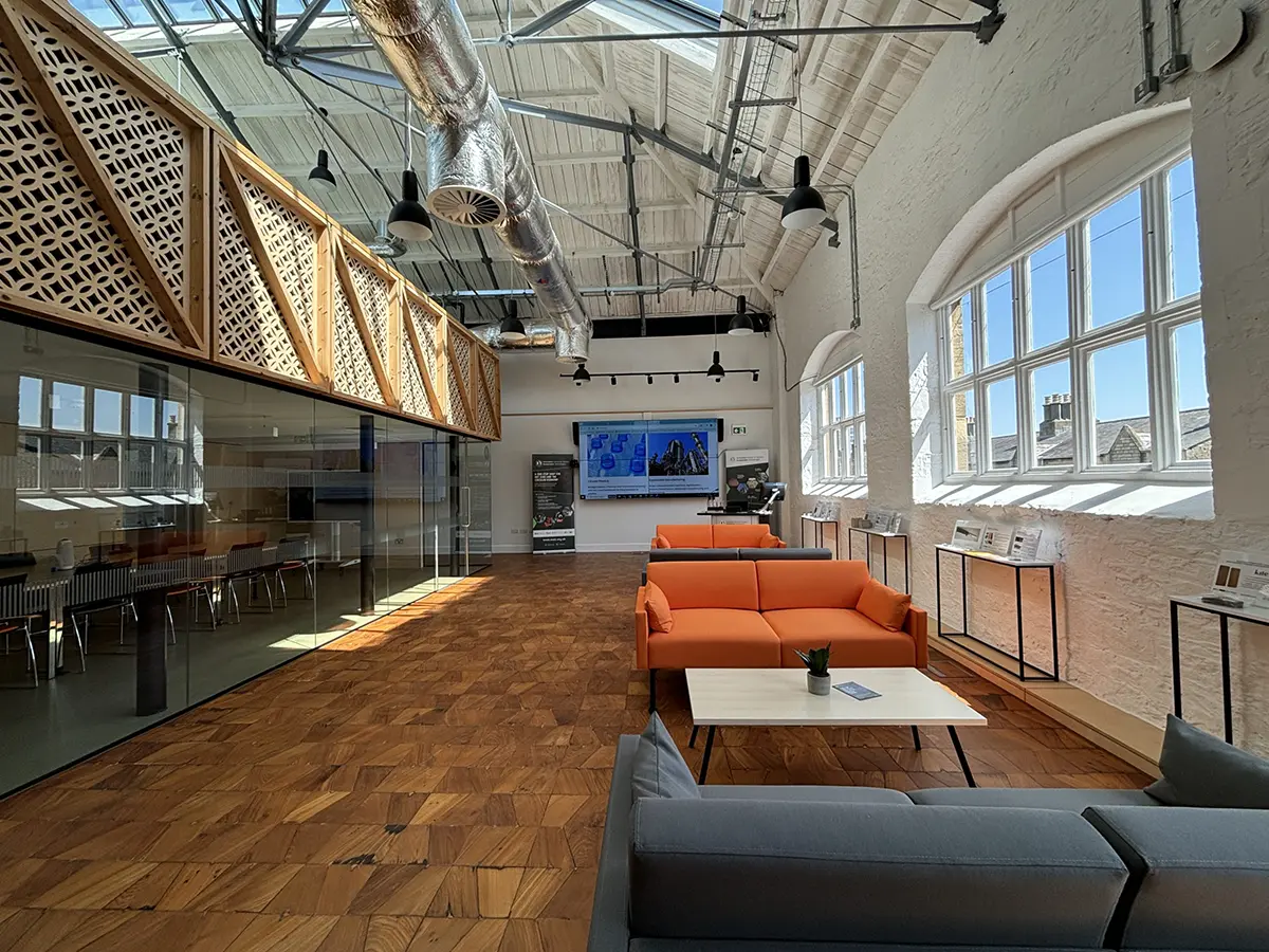 The spacious iCAST interior at Carriage Works, with high ceilings, meeting rooms and shared seating