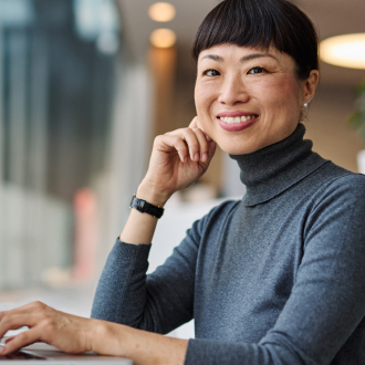 Support specialist wearing a headset at a desk.