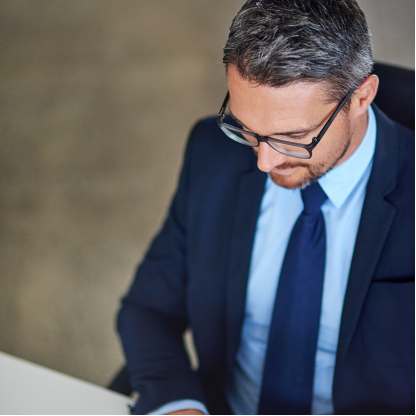 Business leader reviewing information