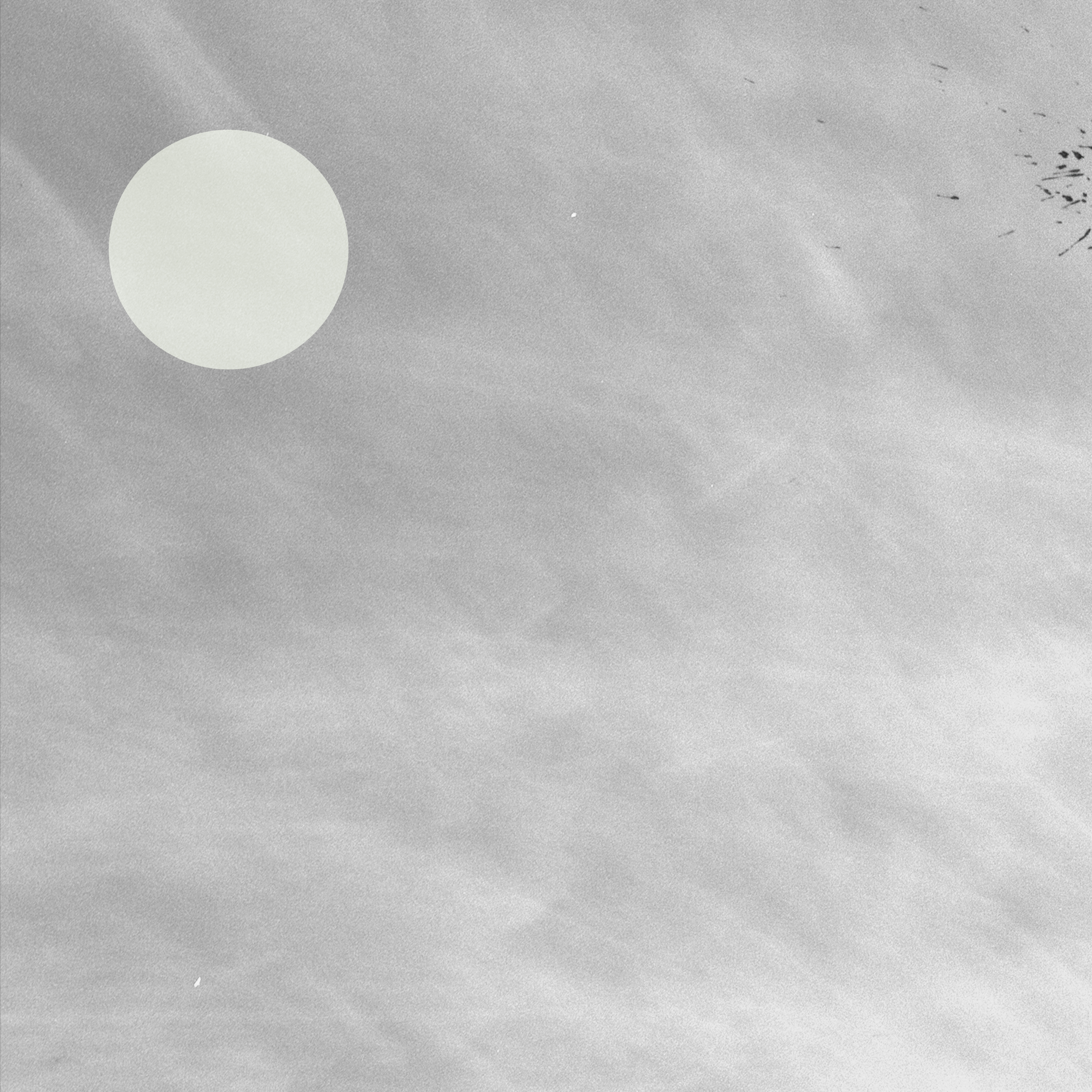 Cover art for 'Cylchred' EP by Gweir released in September 2025: a grey textured background with movement trails behind a slight opaque sage green circle in the top left corner. Some ink splats on the right side imply movement.