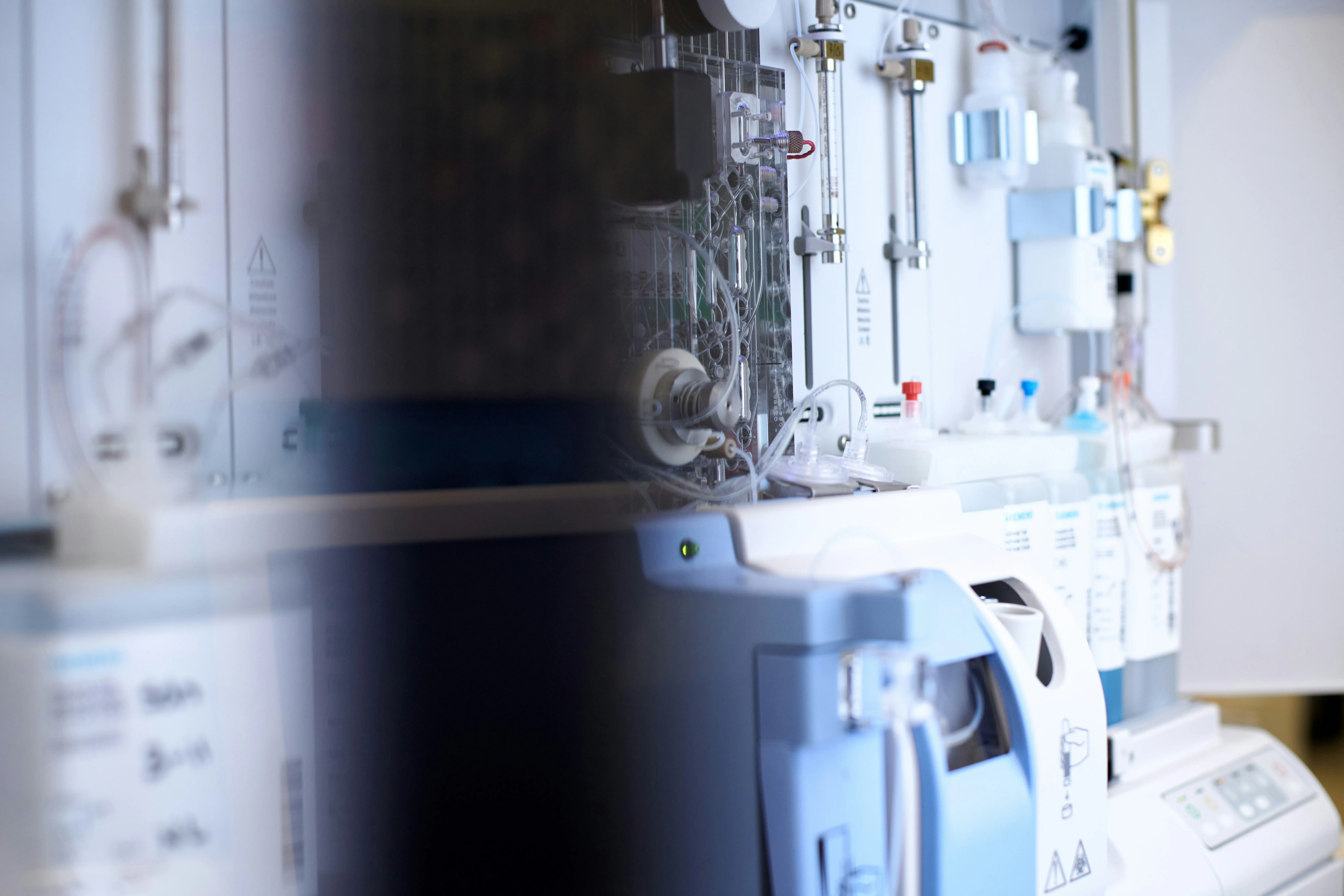 Medical equipment in a care room, out of focus in the foreground
