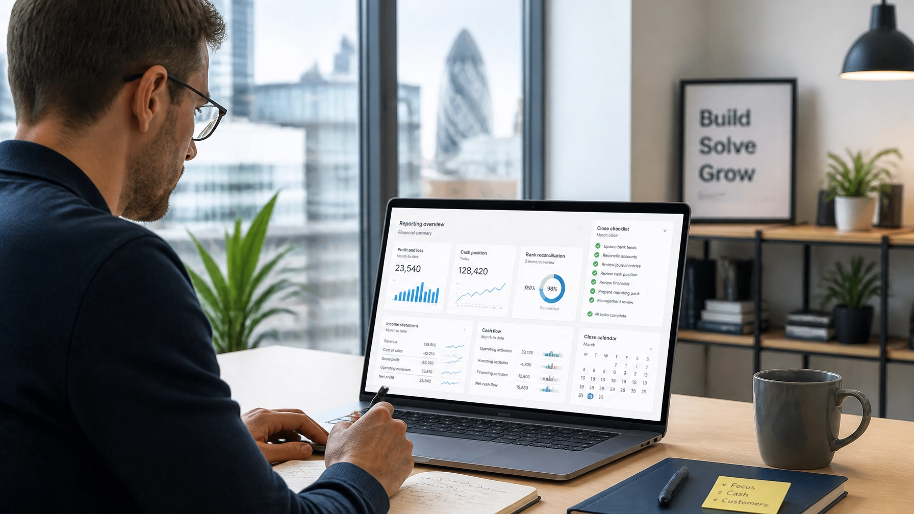 UK tech startup founder reviewing a monthly financial dashboard and month-end close checklist in a modern startup workspace
