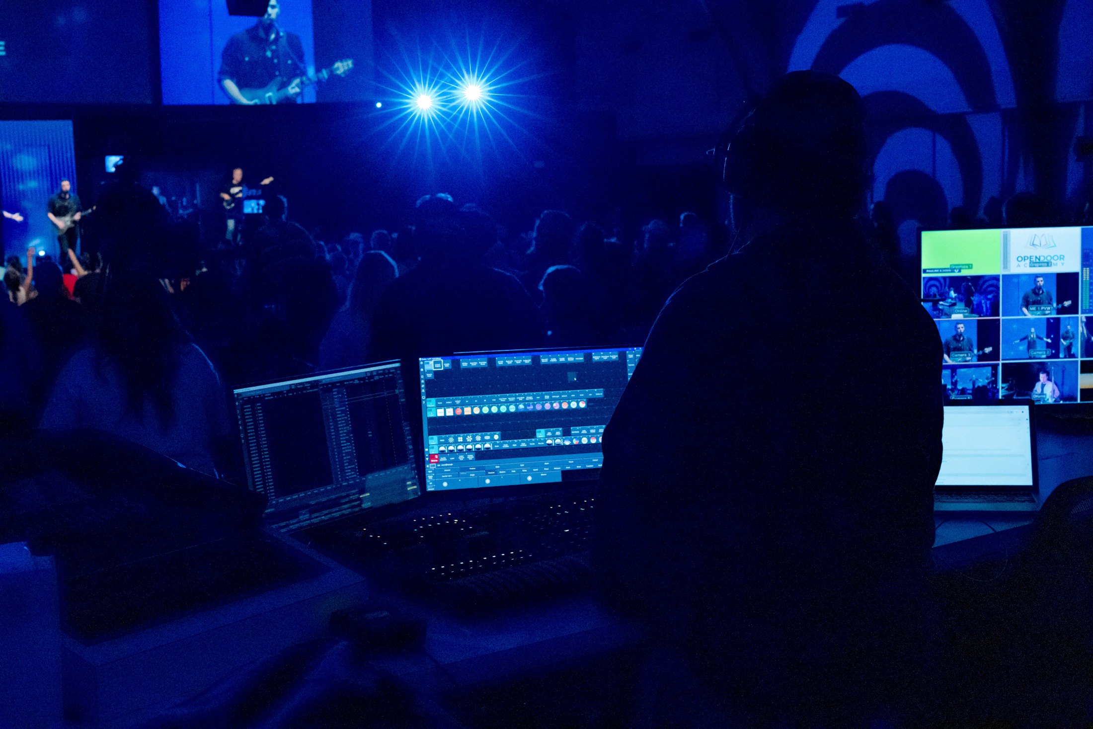 Production desk and screens overlooking a worship service