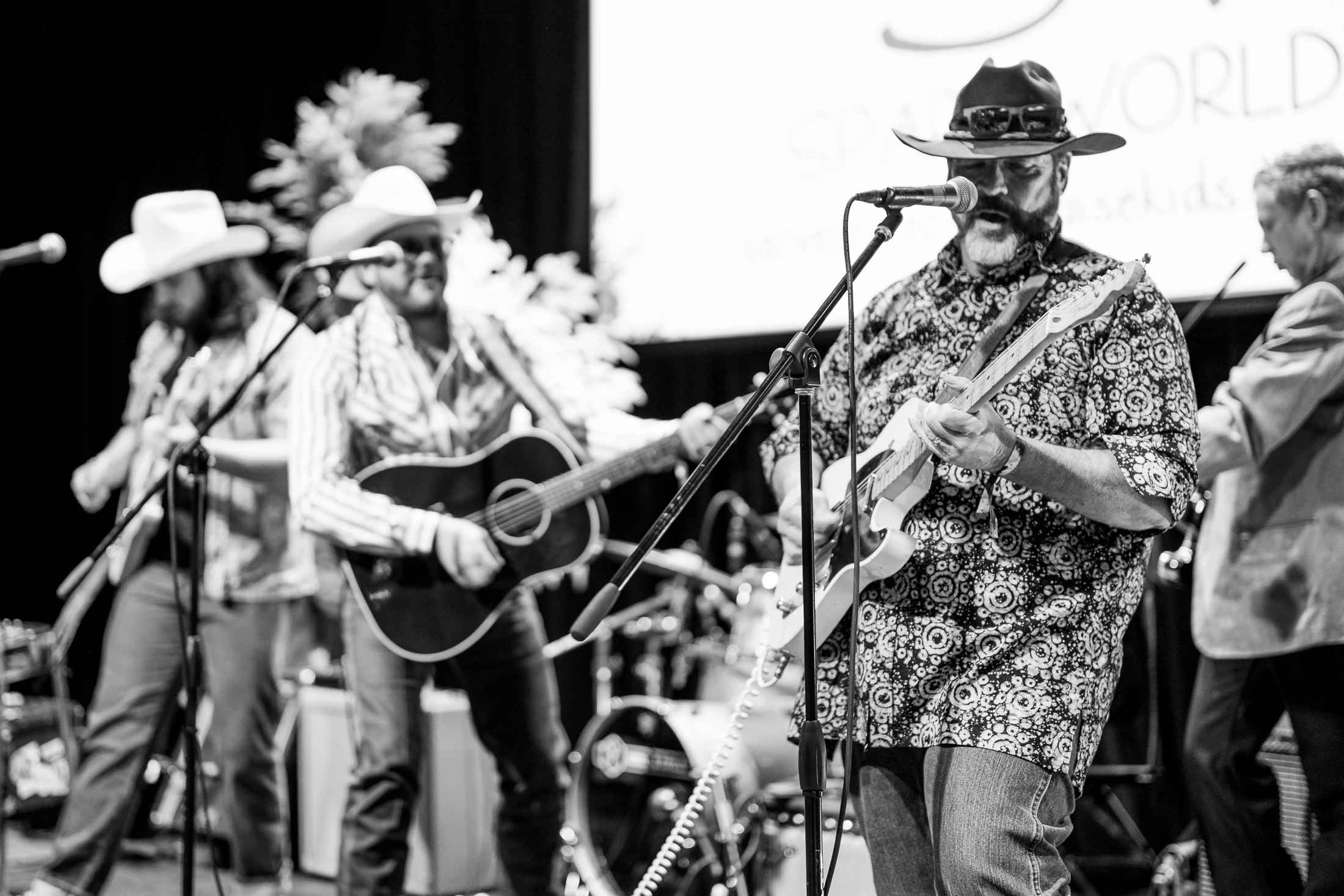 A band performing at a special event, photographed in black and white