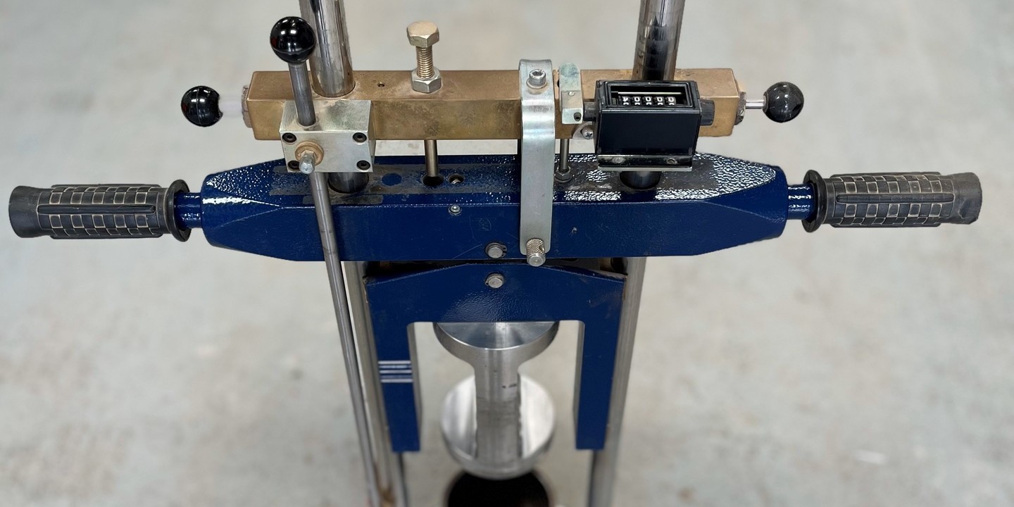 Soil sample being prepared for a moisture condition value (MCV) test