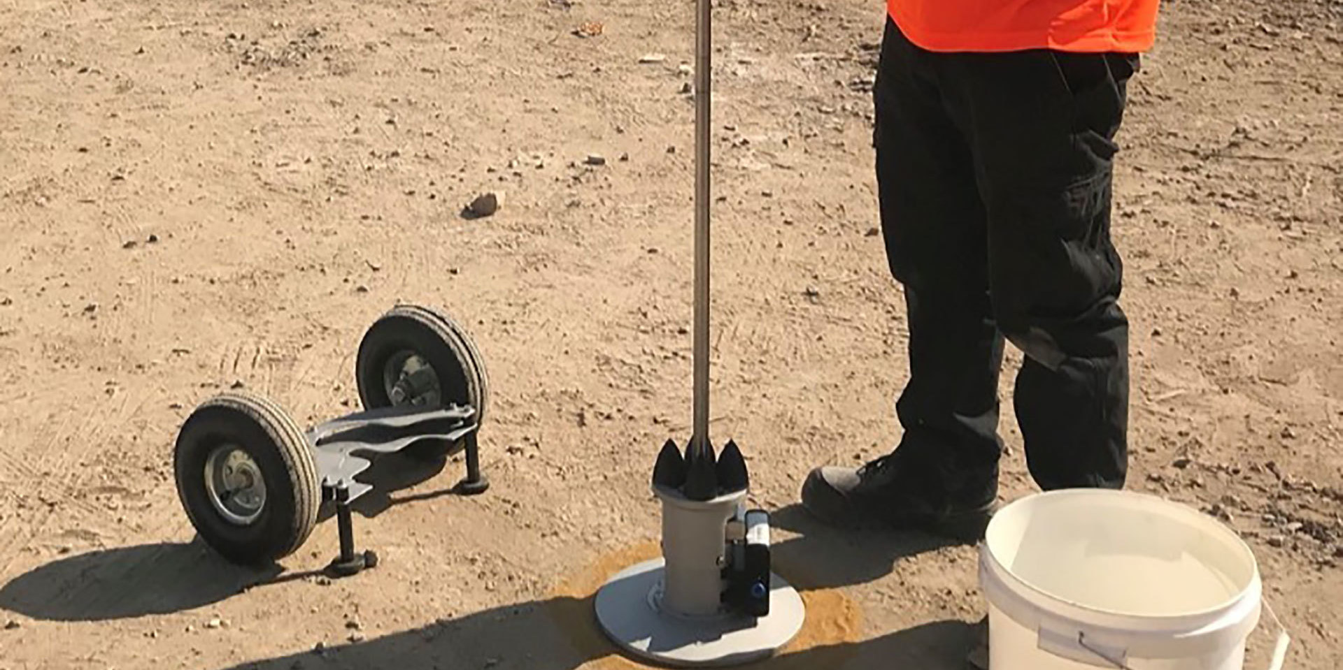 Hixtra technician carrying out a lightweight deflectometer (LWD) test on site